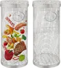 Two cylindrical stainless steel rolling grill baskets, one filled with various food items like steak, sausage, vegetables, and bacon, and the other empty. Produktbild-Vorschau