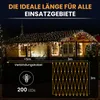 A house decorated with warm white LED string lights at night, with product specifications shown below. Produktbild-Vorschau