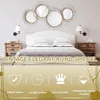 A bedroom scene featuring a wall mirror above a bed, with bedside tables and lamps. Produktbild-Vorschau