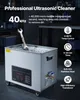 A professional ultrasonic cleaner is shown in a workshop setting, with a wrench submerged in its cleaning tank. Náhľad obrázku produktu