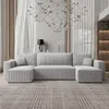 A modern U-shaped sofa in a living room setting. Náhled obrázku produktu