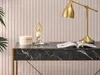 A close-up of a desk with a marble top, a golden lamp, and decorative items. Voir les images du produit