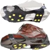 Two pairs of shoe grips with yellow studs are shown, one on a white shoe and one on a brown shoe. Anteprima dell’immagine prodotto