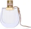 A clear studio shot of a Chloé Nomade Eau de Toilette perfume bottle against a white background. Podgląd zdjęcia produktu