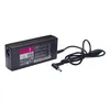 A black laptop power adapter with its cord is shown against a white background. Podgląd zdjęcia produktu