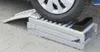 A car ramp is shown on a paved surface with a car tire resting on it. Náhled obrázku produktu