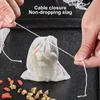Hands are shown closing a small white mesh bag filled with herbs, with loose herbs scattered around. Produktbild-Vorschau