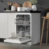 An open dishwasher in a modern kitchen setting, with kitchenware visible on the counter above. Produktbild-Vorschau