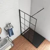 A modern bathroom with a shower enclosure, sink, and towel rack. Produktbild-Vorschau