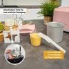 A collection of ice cream maker parts and ingredients are displayed on a kitchen counter, with a small inset image showing someone washing a part in a sink. Produktbild-Vorschau
