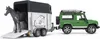 A toy Land Rover Defender towing a horse trailer with a toy horse inside. Produktbild-Vorschau