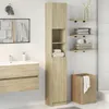 A bathroom scene with a tall cabinet, sink, mirror, shelves, and a laundry basket. Náhled obrázku produktu