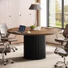 A modern office conference room with a round wooden table and chairs. Anteprima dell’immagine prodotto
