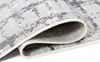 A close-up view of a rolled-up rug, showing its texture and pattern. Anteprima dell’immagine prodotto