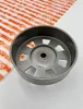 A close-up shot of a metal clutch drum with a patterned paper background. Produktbild-Vorschau