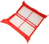 A red plastic lint filter with four white mesh compartments, shown from a diagonal angle against a white background. Produktbild-Vorschau