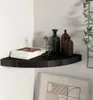 A black corner shelf displaying books and decorative bottles. Náhľad obrázku produktu