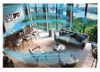 A modern living room with large windows overlooking a city and trees, featuring a dining table, sofa, chairs, and an air purifier. Podgląd zdjęcia produktu