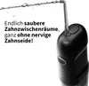 A close-up marketing image of a black oral irrigator with water spraying from the nozzle, accompanied by German text. Produktbild-Vorschau