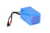 A blue lithium-ion battery pack with attached wires and connectors, isolated on a white background. Náhľad obrázku produktu