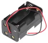 A black plastic battery holder with two AA battery slots, each with a spring terminal. Red and black wires extend from the holder. Anteprima dell’immagine prodotto
