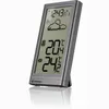 A digital weather station displaying time, weather icons, and indoor/outdoor temperatures. Produktbild-Vorschau