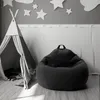 A child's room with a teepee tent and a bean bag chair. Voir les images du produit