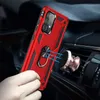 A hand holding a red phone case with a ring holder, magnetically attached to a car vent mount. Anteprima dell’immagine prodotto