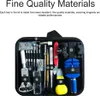 A black carrying case filled with various watch repair tools, neatly organized and labeled with numbers. Produktbild-Vorschau