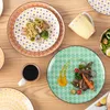 A table setting with plates, a mug, and food. Náhled obrázku produktu