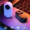 Two mini sport cameras are placed on a laptop keyboard with colorful lighting. Produktbild-Vorschau