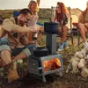 People enjoying a camping trip around a portable wood stove. Náhled obrázku produktu