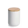 A white ceramic jar with a bamboo lid, isolated on a white background. Produktbild-Vorschau