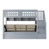A gray bunk bed with stairs and storage shelves is shown against a white background. Náhled obrázku produktu