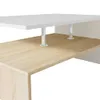 A close-up view of a modern coffee table with a white top and a wood-grain lower shelf, supported by silver cylindrical legs. Podgląd zdjęcia produktu