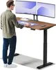A man stands at a standing desk with two monitors, a keyboard, and a mouse. Produktbild-Vorschau
