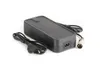 A black power adapter with two cables, one with a European plug and the other with a circular connector, is shown on a white background. Náhled obrázku produktu