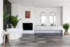 A modern bathroom with a freestanding bathtub, vanity with two oval mirrors, and plants. Náhľad obrázku produktu