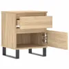 A wooden nightstand with a drawer and a cabinet door open, shown from a side angle on a white background. Náhled obrázku produktu