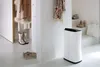An entryway or hallway with coats and shoes, featuring a white dehumidifier. Anteprima dell’immagine prodotto