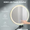 A round LED mirror with touch controls, mounted on a wall above a sink with a faucet. Produktbild-Vorschau