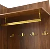 A close-up view of a wooden wardrobe interior with a hanging rail and hooks. Produktbild-Vorschau