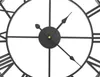 A close-up view of a black metal wall clock with Roman numerals. Anteprima dell’immagine prodotto