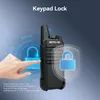 A hand is shown interacting with a walkie-talkie, with graphics indicating a keypad lock feature. Náhľad obrázku produktu