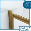 A close-up view of a gold-colored shower enclosure frame against a marble-patterned wall. Produktbild-Vorschau