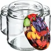 Several empty glass jars are arranged together, with a decorative lid featuring a fruit pattern placed in front of them. Produktbild-Vorschau