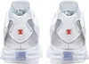 The back view of a pair of white Nike Shox TL sneakers with metallic silver accents and orange detailing. Voir les images du produit