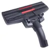 A vacuum cleaner floor head attachment with red bristles. Produktbild-Vorschau
