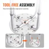 Close-up view of the underside of a shower stool, highlighting its tool-free assembly mechanism with inset diagrams showing the process. Produktbild-Vorschau