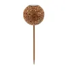 A decorative solar-powered garden light shaped like a sphere with star cutouts, mounted on a stake. Produktbild-Vorschau